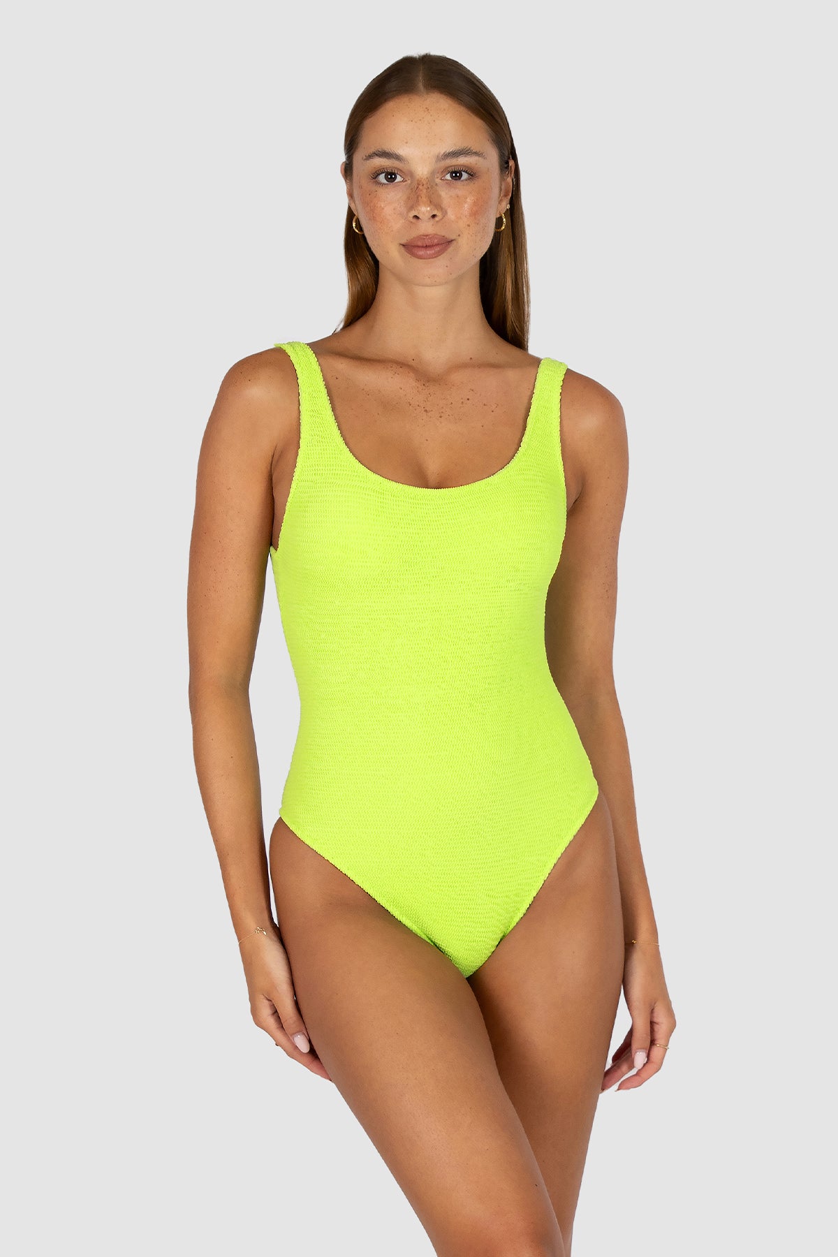 Ibiza Low Back One Piece in zest crinkle fabric with flattering low back, elongated leg line, rio coverage, shelf support, and removable cups from Australian swimwear brand Baku.