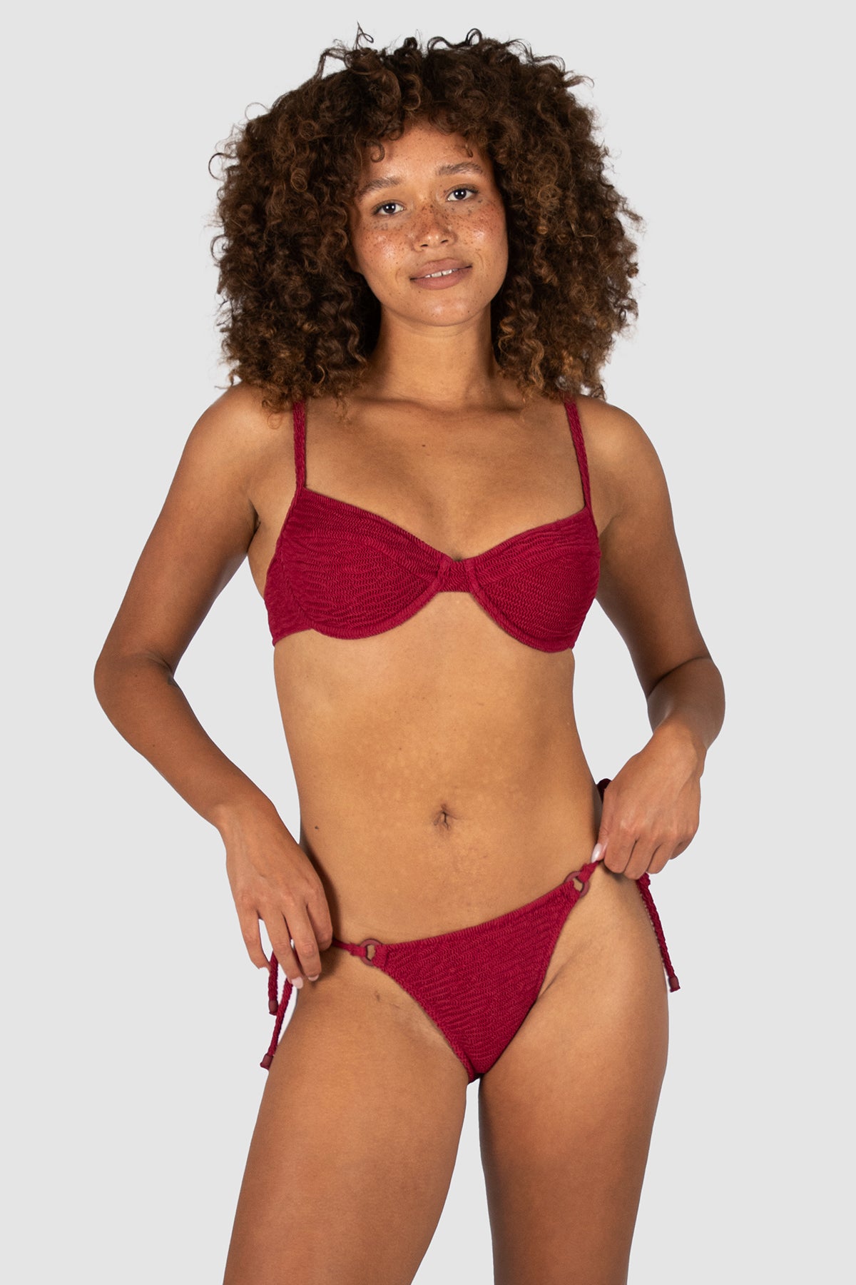 biza B–C Underwire Bra Bikini Top in scarlet crinkle fabric with underwire fit, removable moulded cups, convertible adjustable straps, and clip-back fastening from Australian swimwear brand Baku.