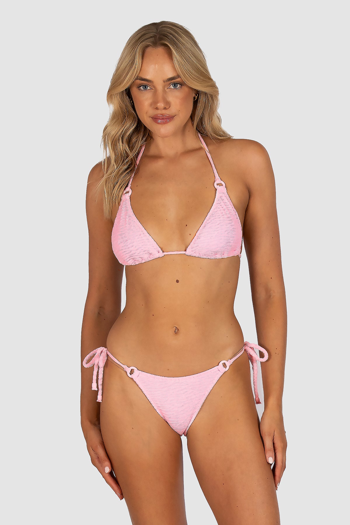 Ibiza Rio Tie Side Bikini Bottom in pink sorbet crinkle fabric featuring tie sides at the hip and flattering rio cheeky coverage by Australian swimwear brand Baku.