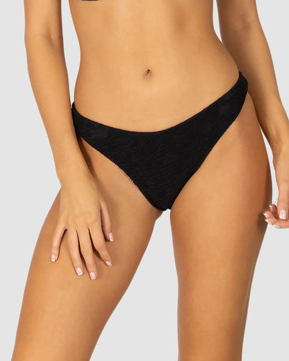 Ibiza Cheeky High Cut Bikini Bottom in black crinkle fabric designed with scoop front, high-cut leg opening, and cheeky rio coverage by Australian swimwear brand Baku.
