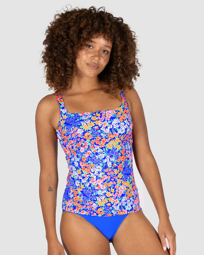 Baku’s Biarritz tankini top featuring a vibrant floral print, with removable cups, boning support, and adjustable straps for a comfortable A-D cup fit.