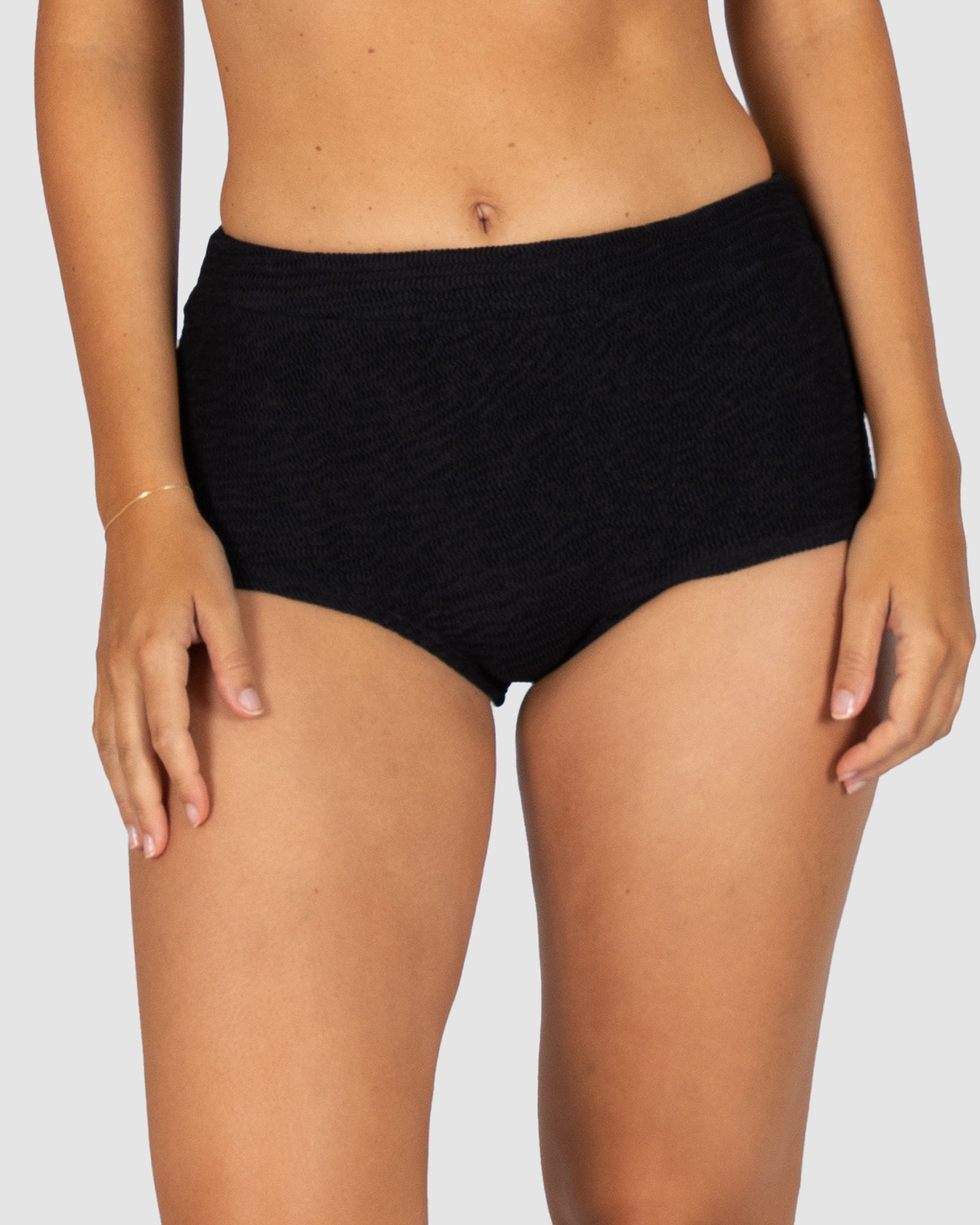 Ibiza Cheeky Boy Leg Bikini Bottom in black crinkle fabric designed with high waist fit and cheeky style coverage by Australian swimwear brand Baku.