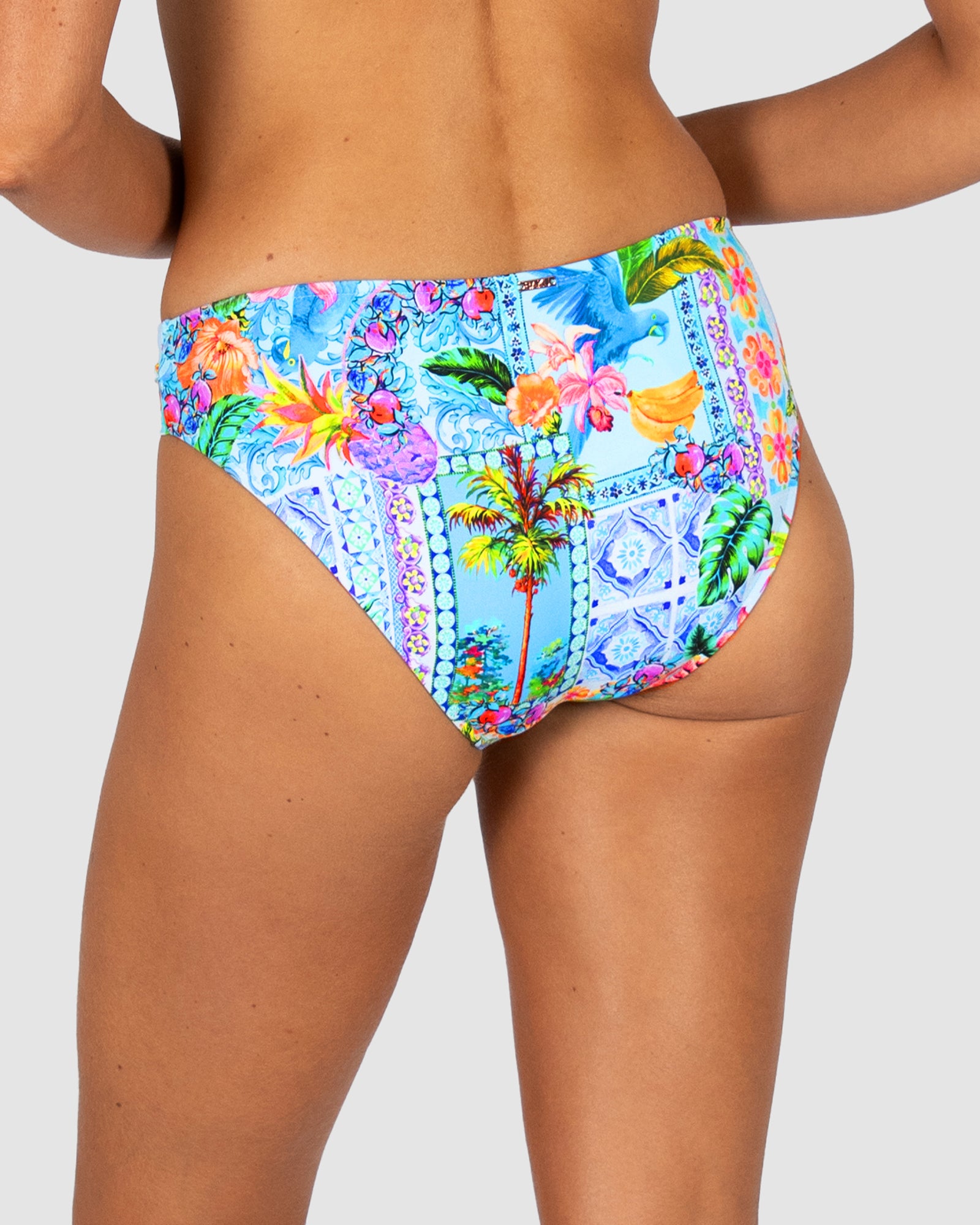 Colorful tropical print bikini bottom on a plain background