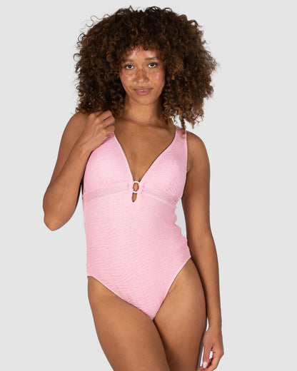 Ibiza Longline One Piece in pink sorbet crinkle fabric featuring a deep neckline with ring trim, removable cups, full lining, and boning support by Australian swimwear brand Baku.