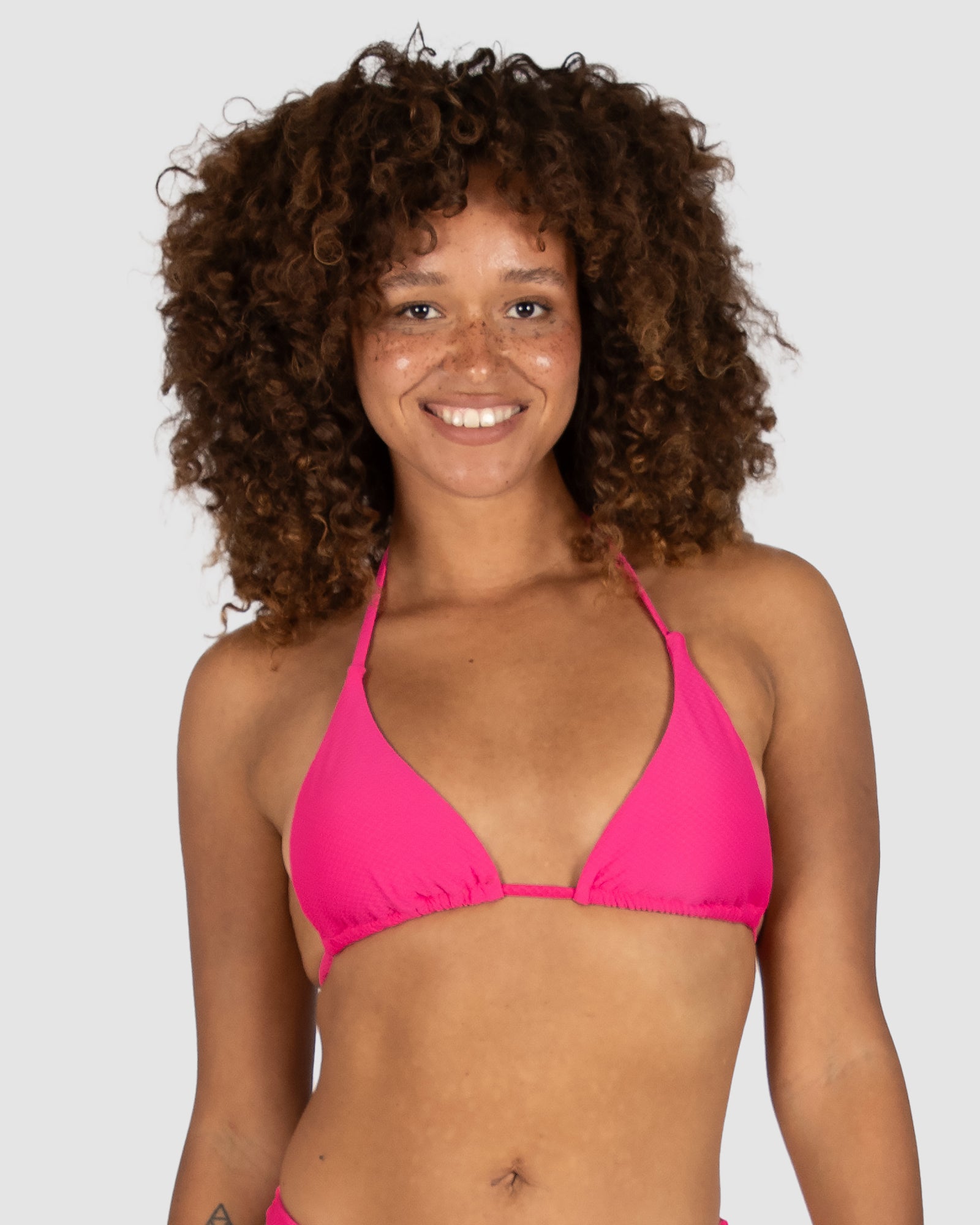 Baku's Rococco Slide Triangle Bikini Top in Dragonfruit – a hot pink triangle bikini with removable soft cups and adjustable tie straps. Made from soft Spanish textured fabric. Baku is an Australian swimwear brand.