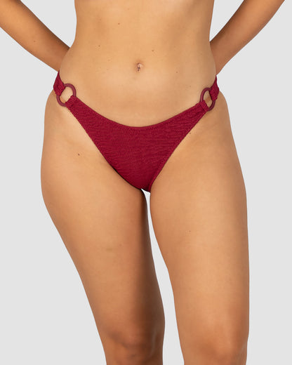 Ibiza Ring Side Hipster Bikini Bottom in scarlet crinkle fabric with ring side detail, dipped waistline, and regular back coverage from Australian swimwear brand Baku.