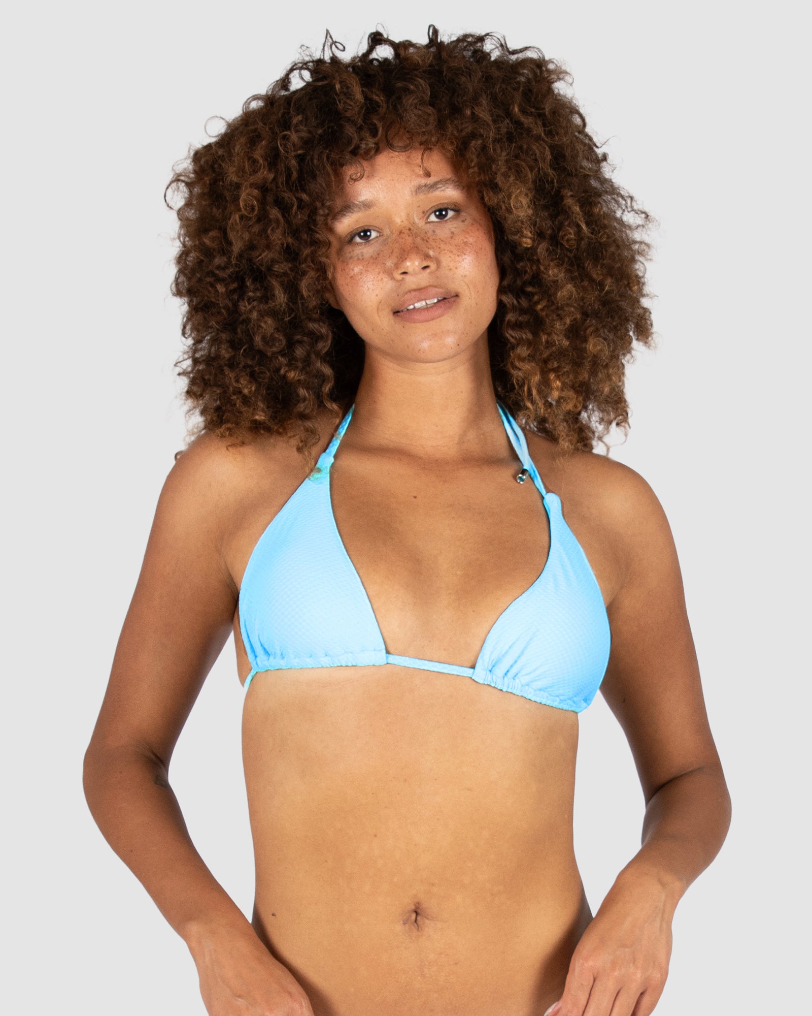 Baku's Rococco Slide Triangle Bikini Top in Arctic Blue – a pale sky blue triangle bikini top with removable soft cups and neck/back ties. Designed in Australia with Spanish fabric. Beachwear by BAKU Australia.