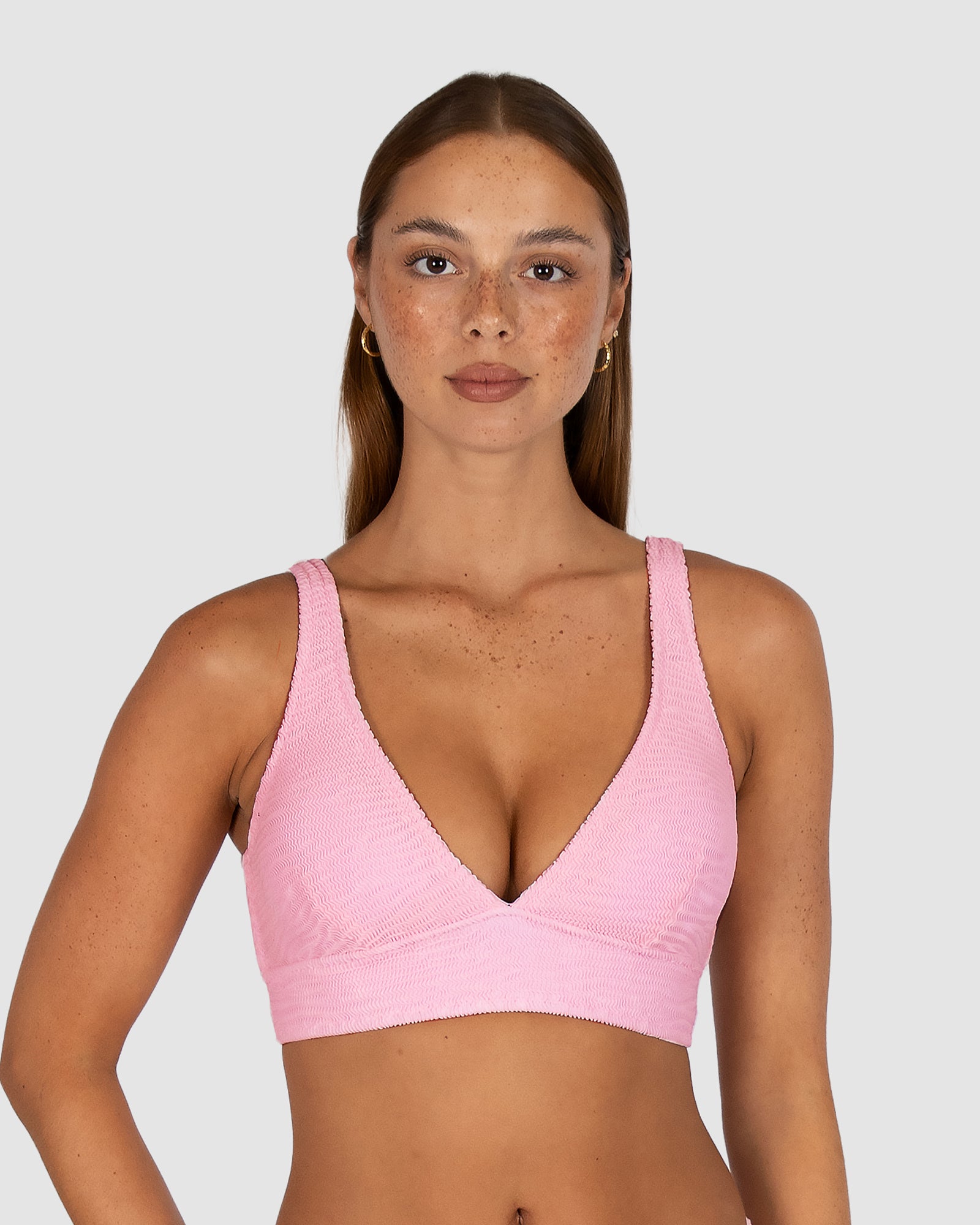 Ibiza D–DD Longline Bra Bikini Top in pink sorbet crinkle fabric featuring flattering dropped neckline, under-bust mesh support, removable cups, boning, and multiway adjustable straps by Australian swimwear brand Baku.
